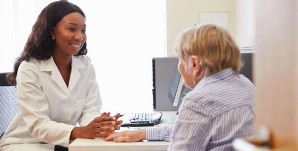 Pharmacist reviewing a patient's medication list